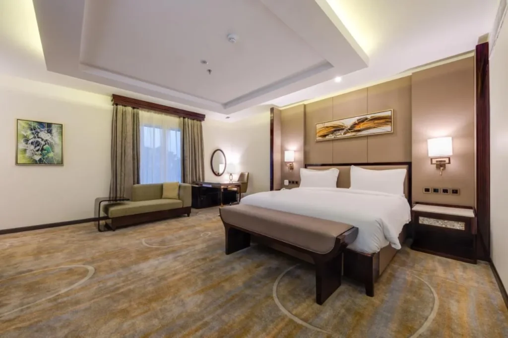 Deluxe room bed and bench