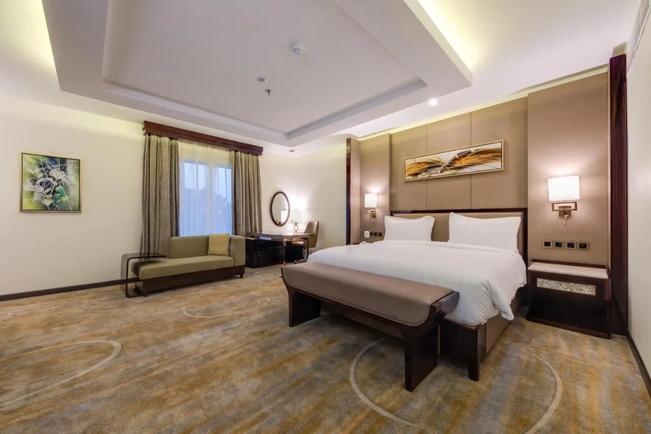 Deluxe room bed and bench